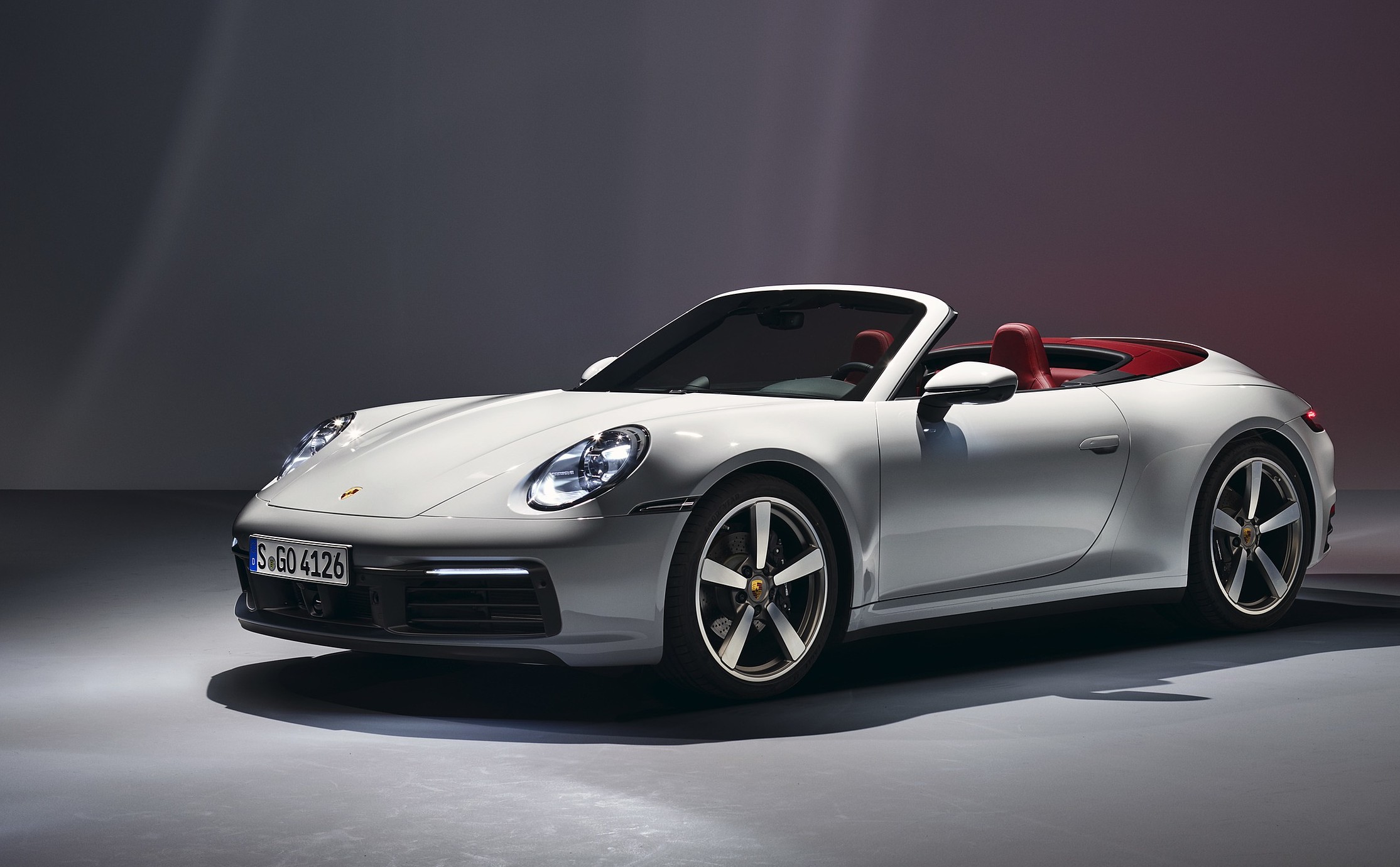 White Porsche 911 Cabriolet (992) — same model shown for reference